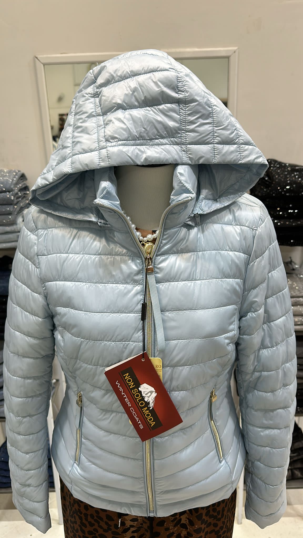 Piumino celeste